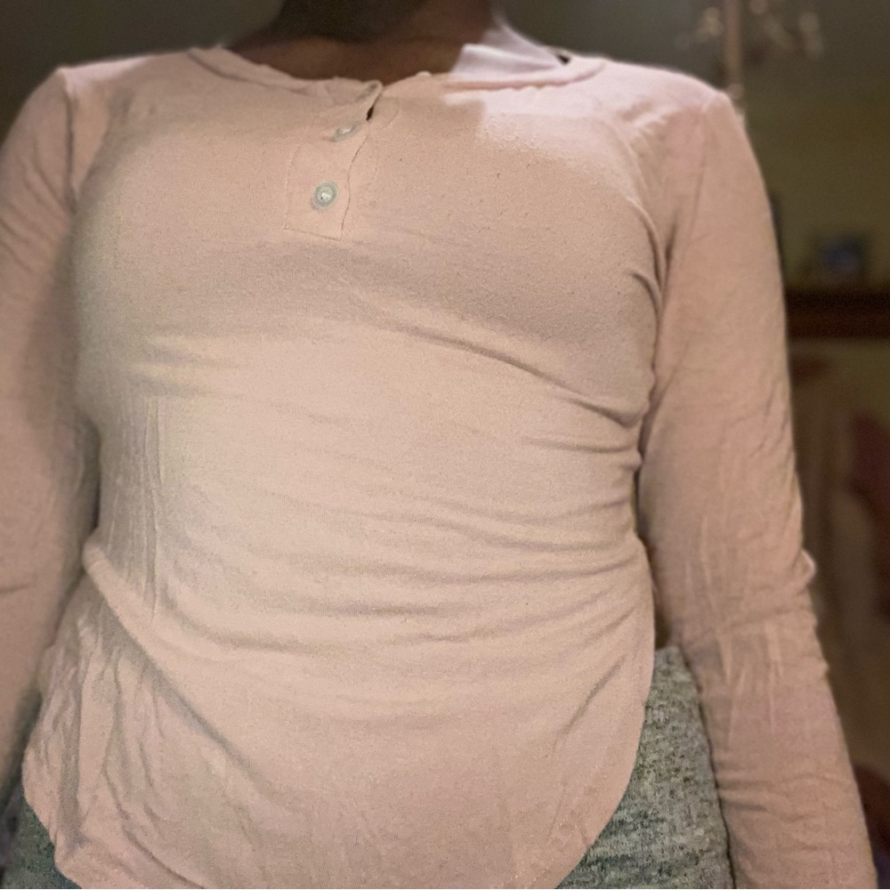 pink long sleeve cropped shirt buttoned up